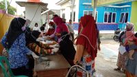 Penyelenggaraan vaksin Corona dihalaman Desa Cikande, Cilebar, Karawang (19/11-2021)