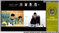 Wali Kota Depok, Mohammad Idris saat menyampaikan Raperda usulan Pemkot Depok pada rapat paripurna secara virtual, Jumat (11/11/22).